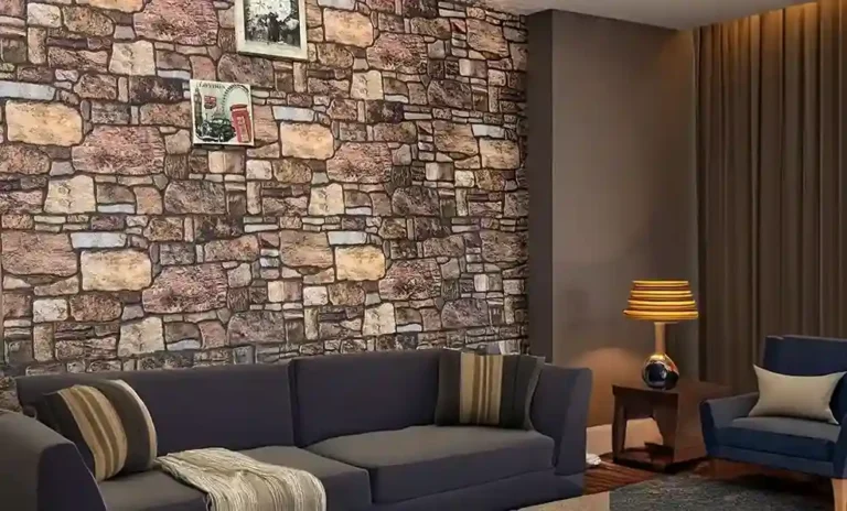 Living room with a faux stone wall, a sofa, an armchair, and warm lighting